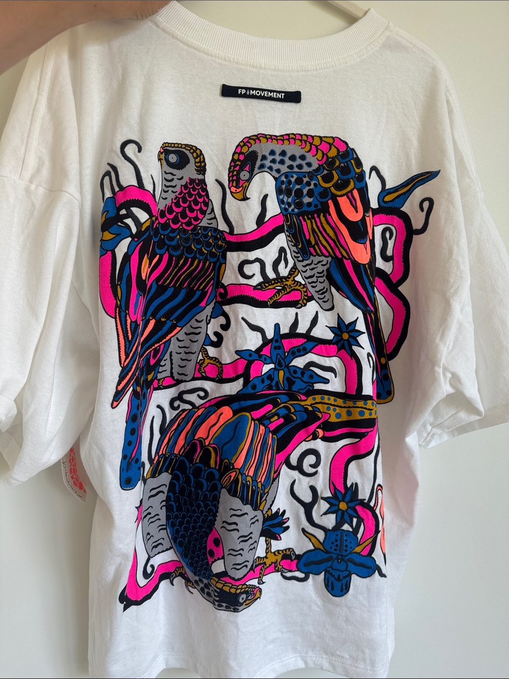 *SOLD OUT STYLE* FP MOVEMENT White Graphic Tee with Vibrant Parrot Print